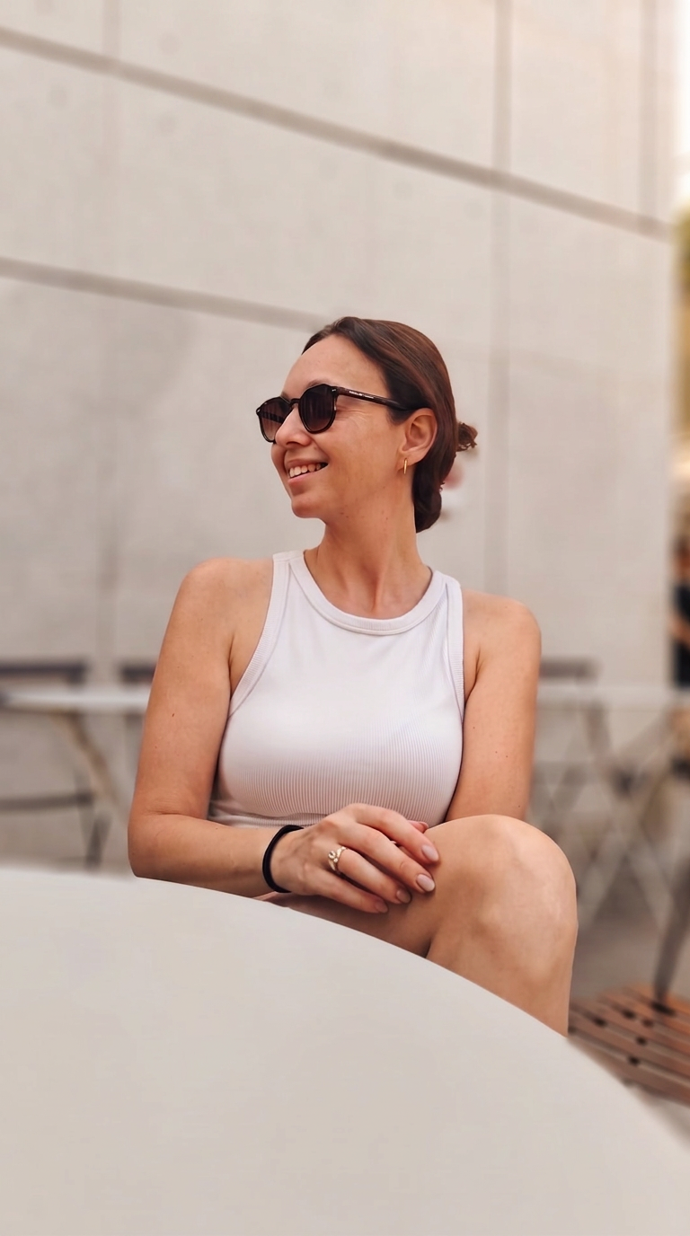 Jenny Radko, UGC creator, seated at a bright café table